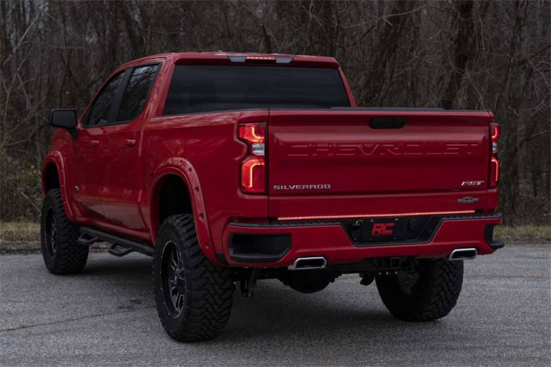 Rough Country quad-row tailgate light strip mounted between tailgate and bumper